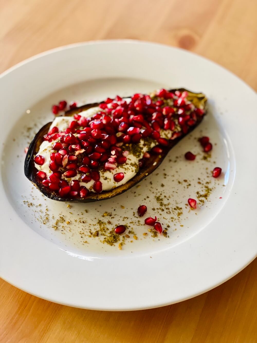 Roasted eggplant with greek yogurt, za'atar and pomegranate